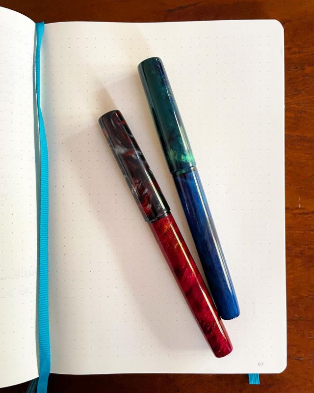 Finally got a chance to pay these pretties some attention! Stabilised wood and resin pairings from @pensbycasey_ . The photo doesn't do them justice; the red burl is gorgeous and the blue and green colourshift resin is amazing. They don't have their perfect ink matches yet, but that's okay, I'll use up what is in them and try a different combo next time.#fountainpen #fountainpens #handmadeinaustralia